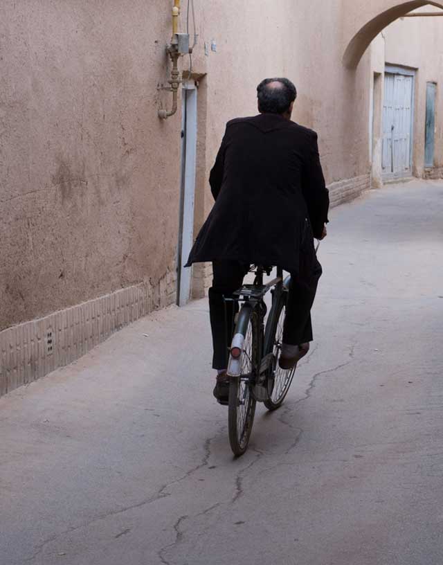 Man cycling, Yazd, Iran