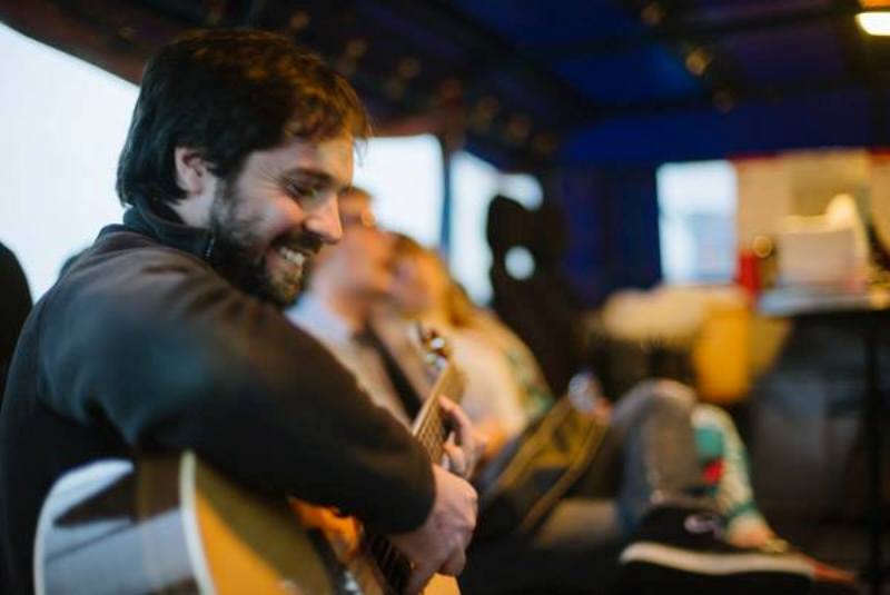 Sam playing the guitar