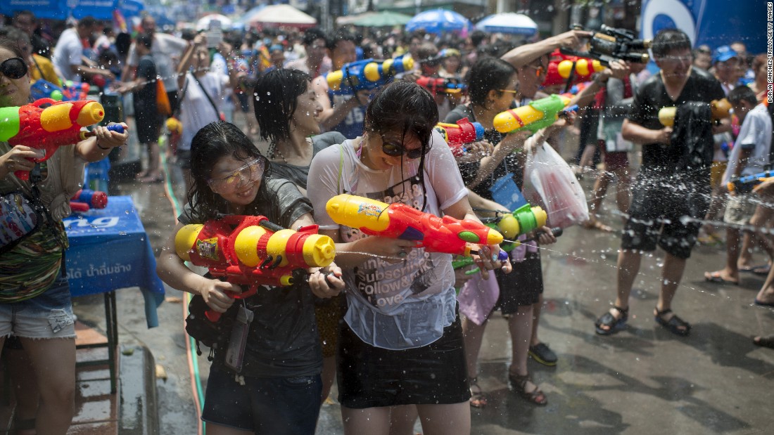 Throwing water over each other to wash away the past on Buddhist New Years in Thailand