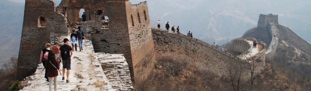 A group of people walking along the Great Wall of China