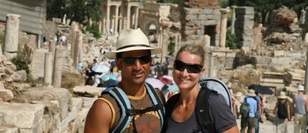 couple posing in front of ruins